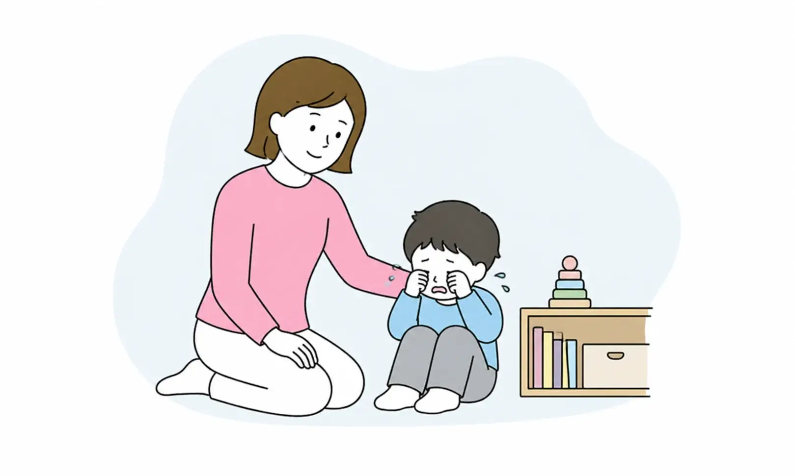泣いている子どもに寄り添う保護者